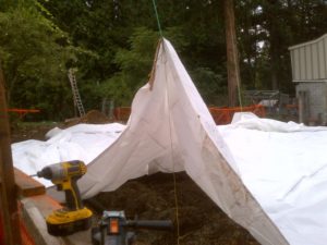 I attached all lines to the tarp by wrapping them around a 1x4 and then taking a second 1x4 and screweinng them together while sandwiching the out edge of the tarp (which has a chord sewn into the edge to provide strength)