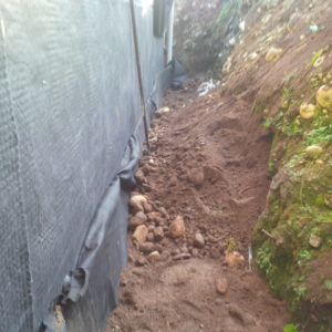 Because I am not compacting the west wall, I also do not need to have rock free soil.  I just made sure there were no large rocks up against the plywood.